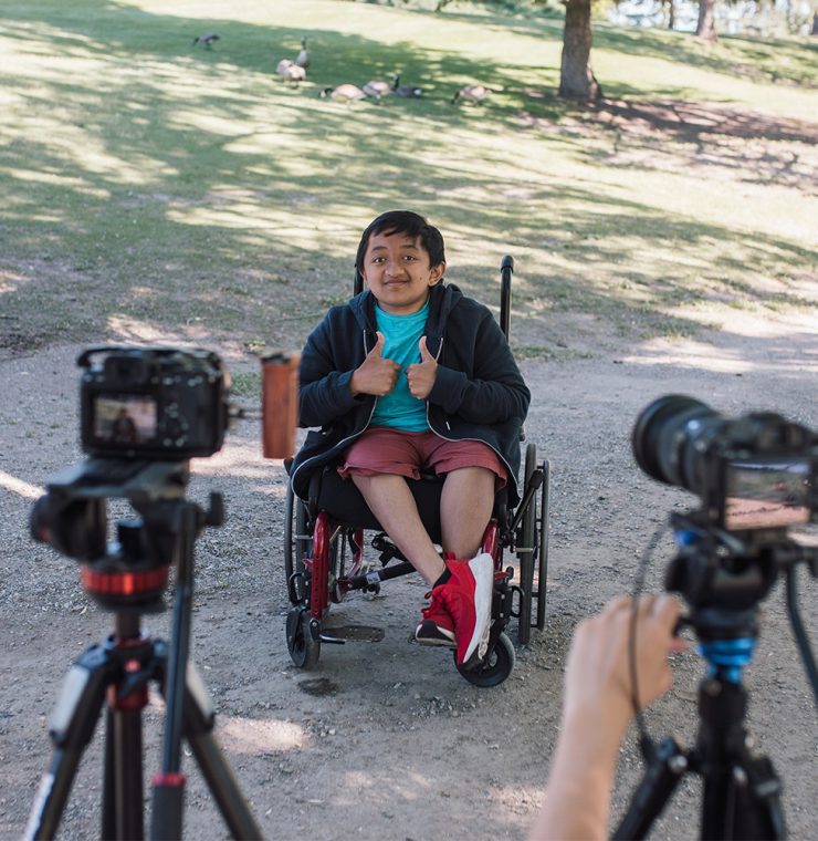 Canuck Place child being interviewed outdoors while enjoying recreation therapy activities at Canuck Place Children's Hospice